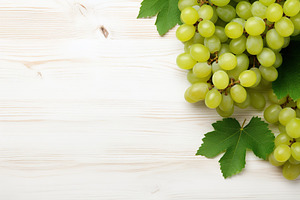 Ripe green grape on wooden background, a Food & Drink Photo by AlyaAnd