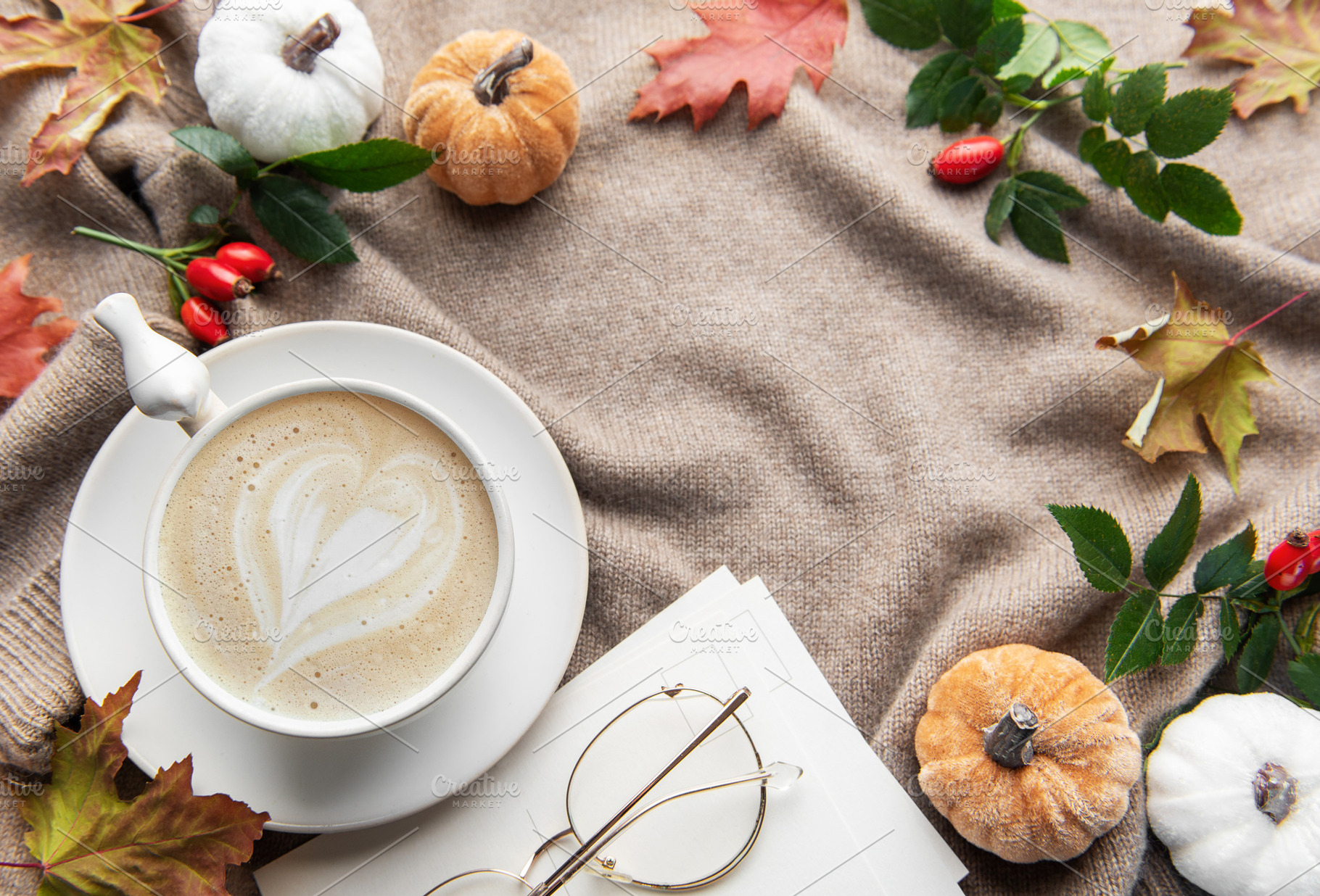 Autumn coziness with coffee, pumpkins, and fall leaves, a Holiday Photo by Olena Rudo