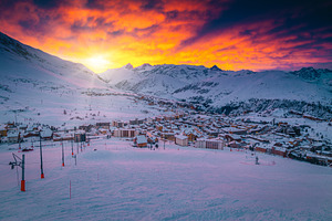 Colorful clouds over the ski resort, an Architecture Photo by Alpine Dreams