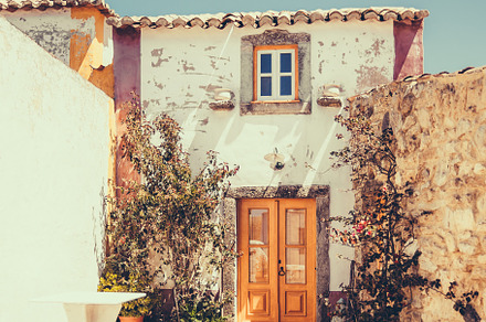 Rustic stone house front patio