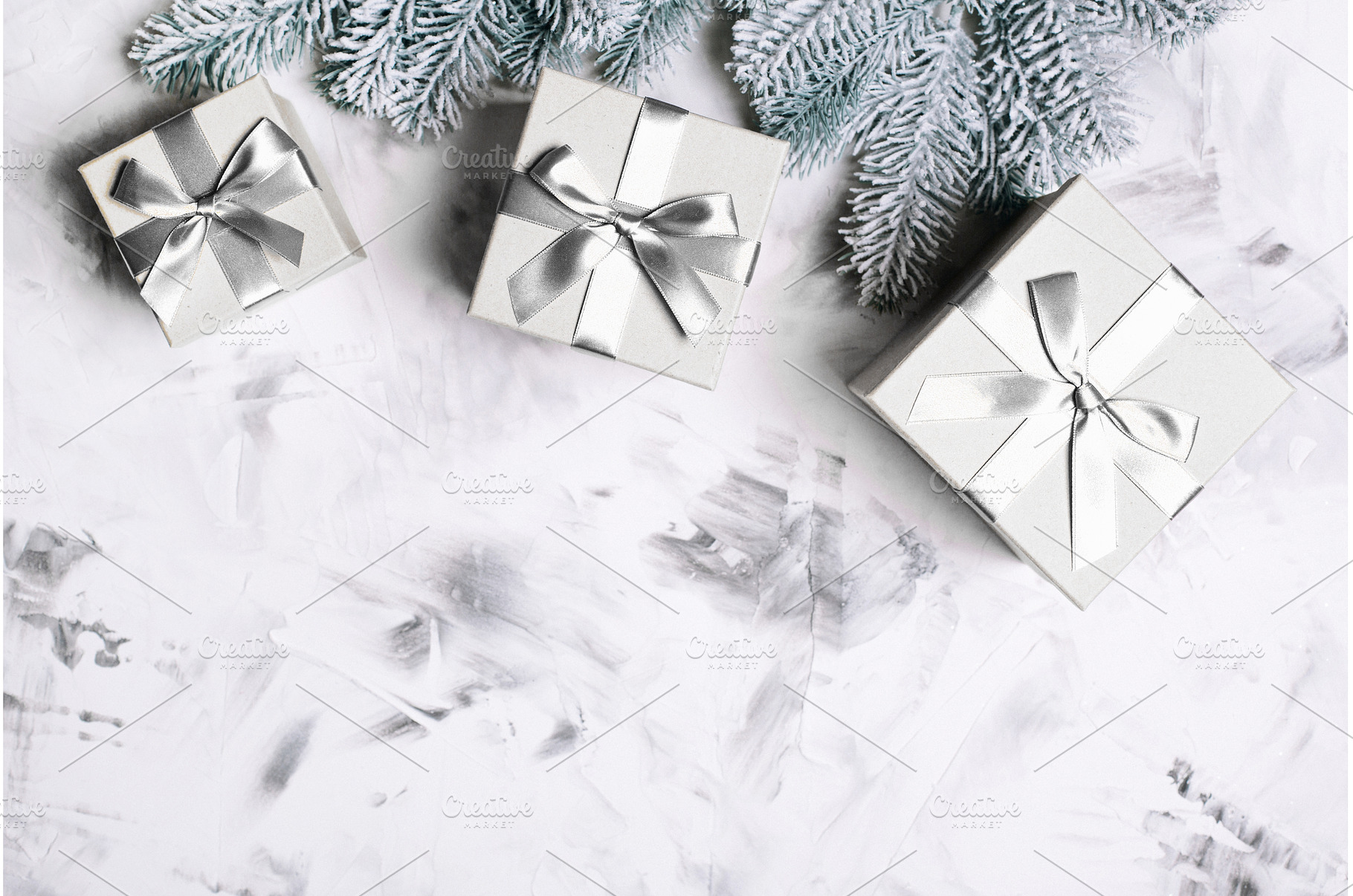 Gray gift boxes and frosted fir, a Holiday Photo by Anna Efetova