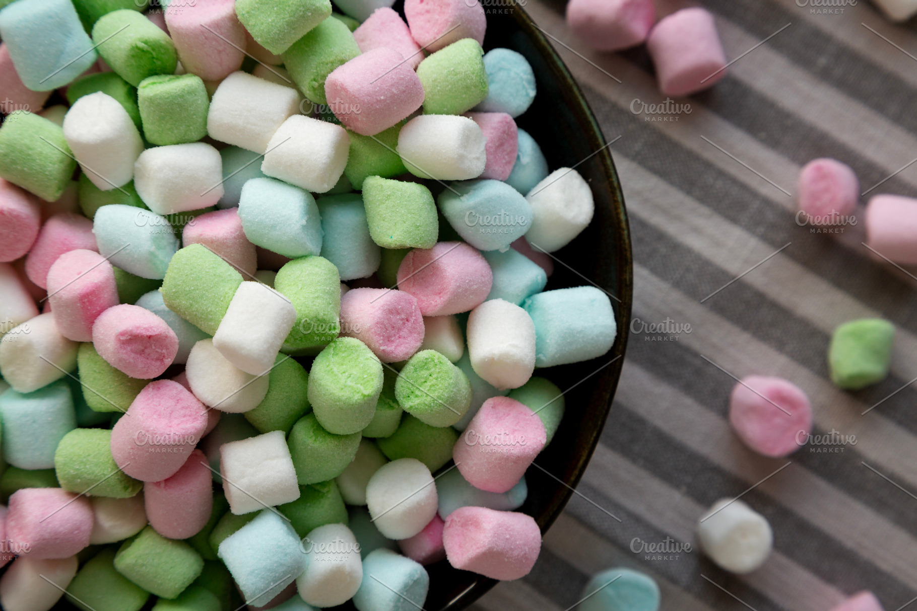 Fruity Colored Rainbow Marshmallows in a Bowl, top view. Close-u, a Food & Drink Photo by LiudmylaChuhunova