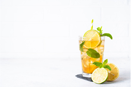 Iced tea with lemon, lime, mint and, a Food & Drink Photo by Nadia-nb