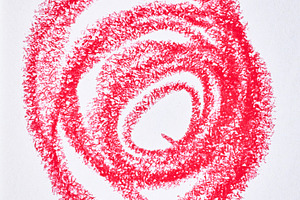 A red circular spiral drawn with a wax crayon or pencil on white, an Abstract Photo by ndanko