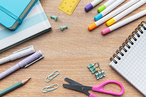 Colorful school and office supplies on wooden desk, a School & Education Photo by Olena Rudo