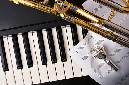 Concert for trombone and piano with instruments and sheet music, an Arts & Entertainment Photo by Davizro's Market