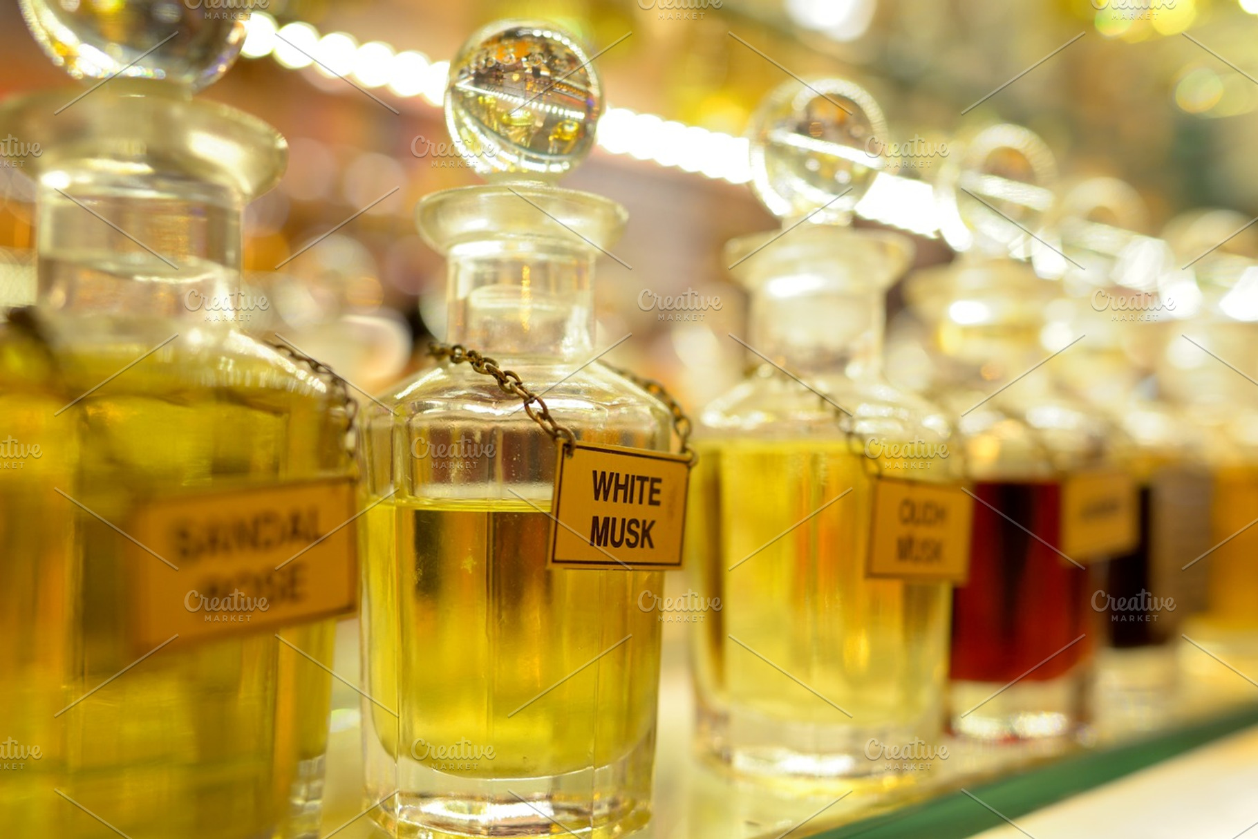 Perfume bottles containing perfume, perfumes, and fragrance, an Abstract Photo by jcfmorata - Photography