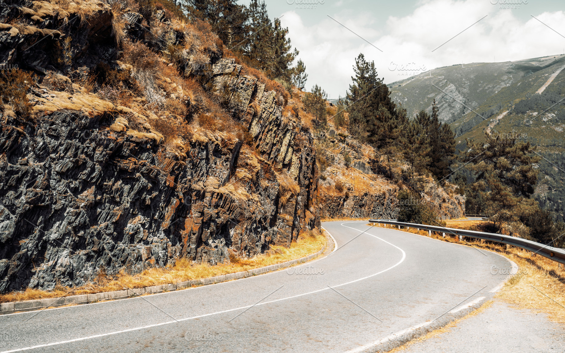 Curving mountain road view, a Transportation Photo by SkyNext
