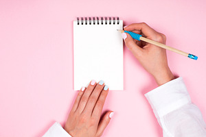 Hand writing wish list in notepad on, a Business Photo by Anna Efetova