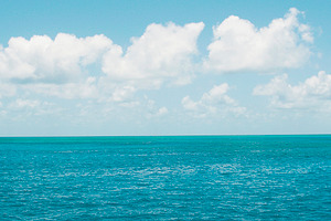 Blue Ocean White Clouds Stock Photo