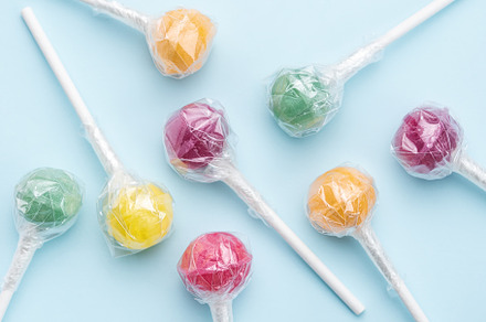 Sweet lollipops on blue background, a Food & Drink Photo by Olena Rudo
