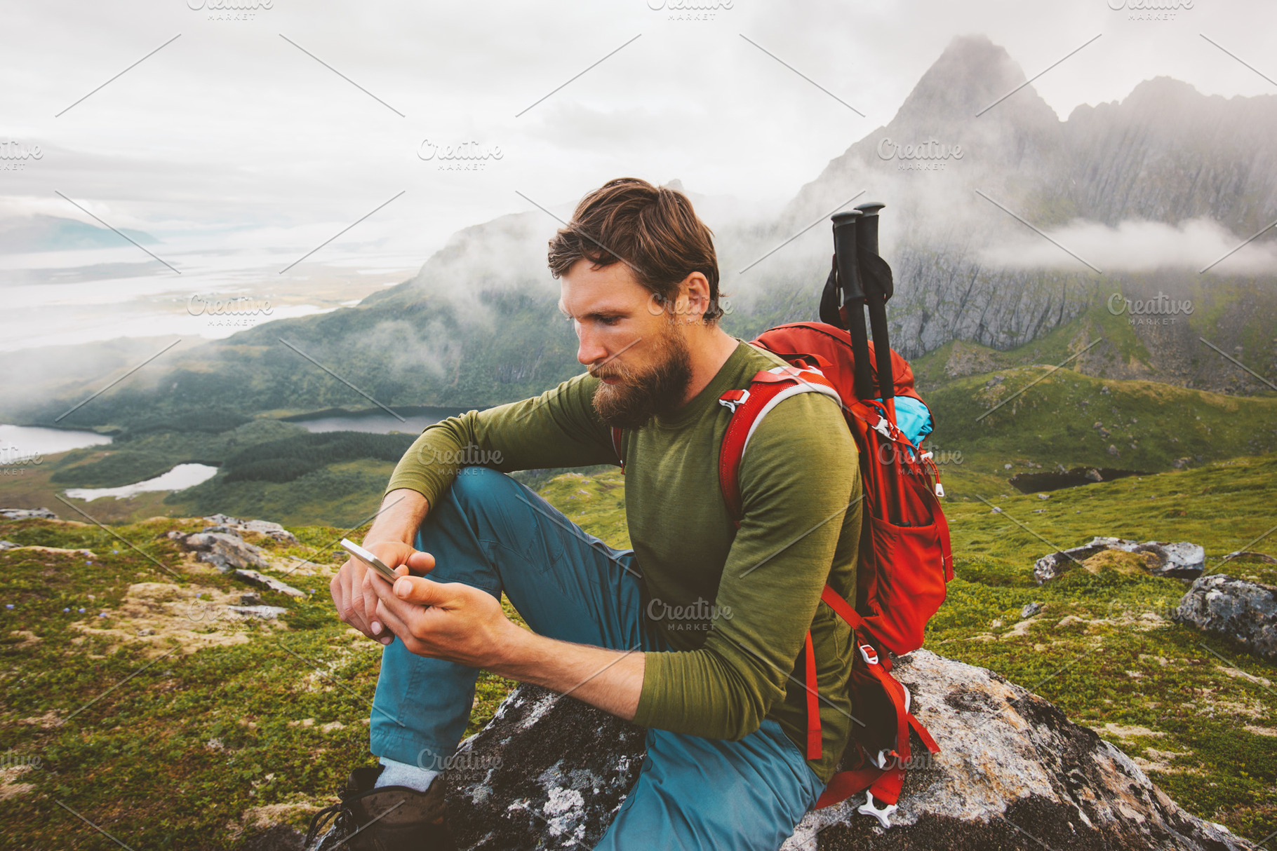 Man hiker using smartphone applicati featuring vacations, working, and remote, a Person Photo by e v e r s t