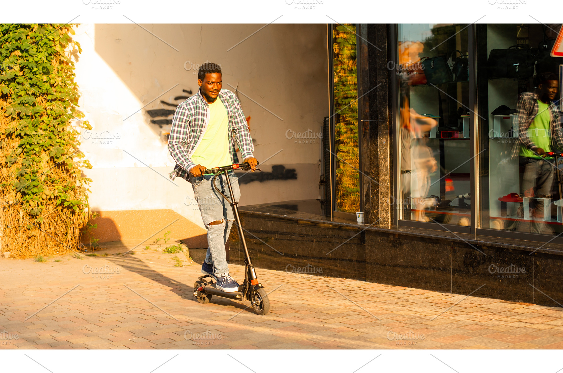 The young man with a scooter is, a Person Photo by oksix
