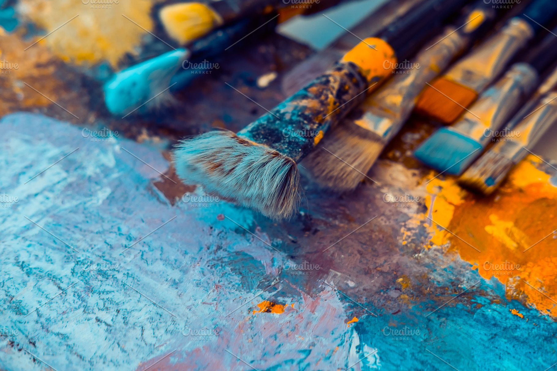 Artistic brushes on painted canvas stock photo containing brushes and paints, an Arts & Entertainment Photo by Valeryia P.