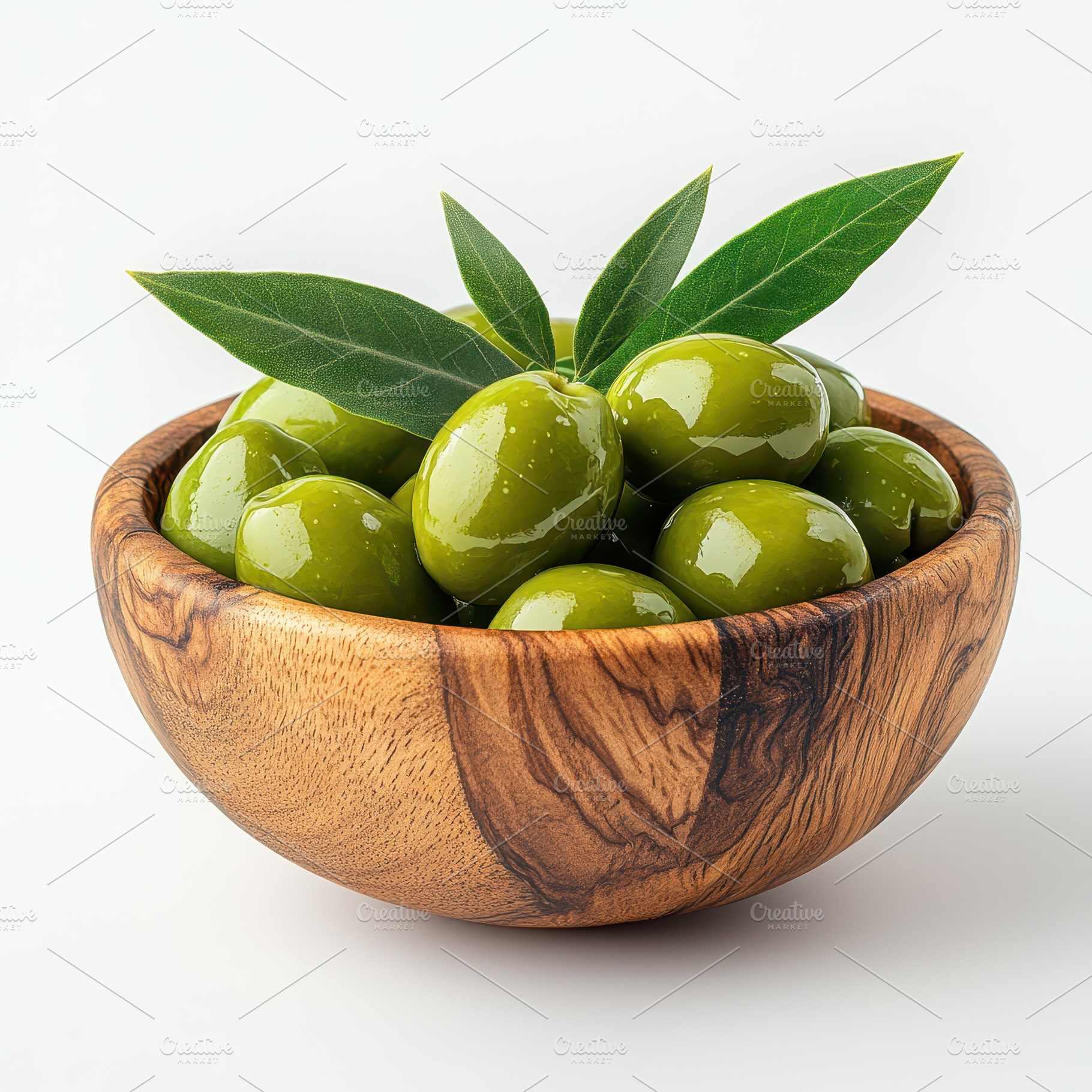 Green olives in wooden bowl with lea, a Food & Drink Photo by Pixeness Studio