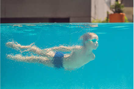 Boy having fun playing underwater in, a Person Photo by Elizaveta Galitskaya