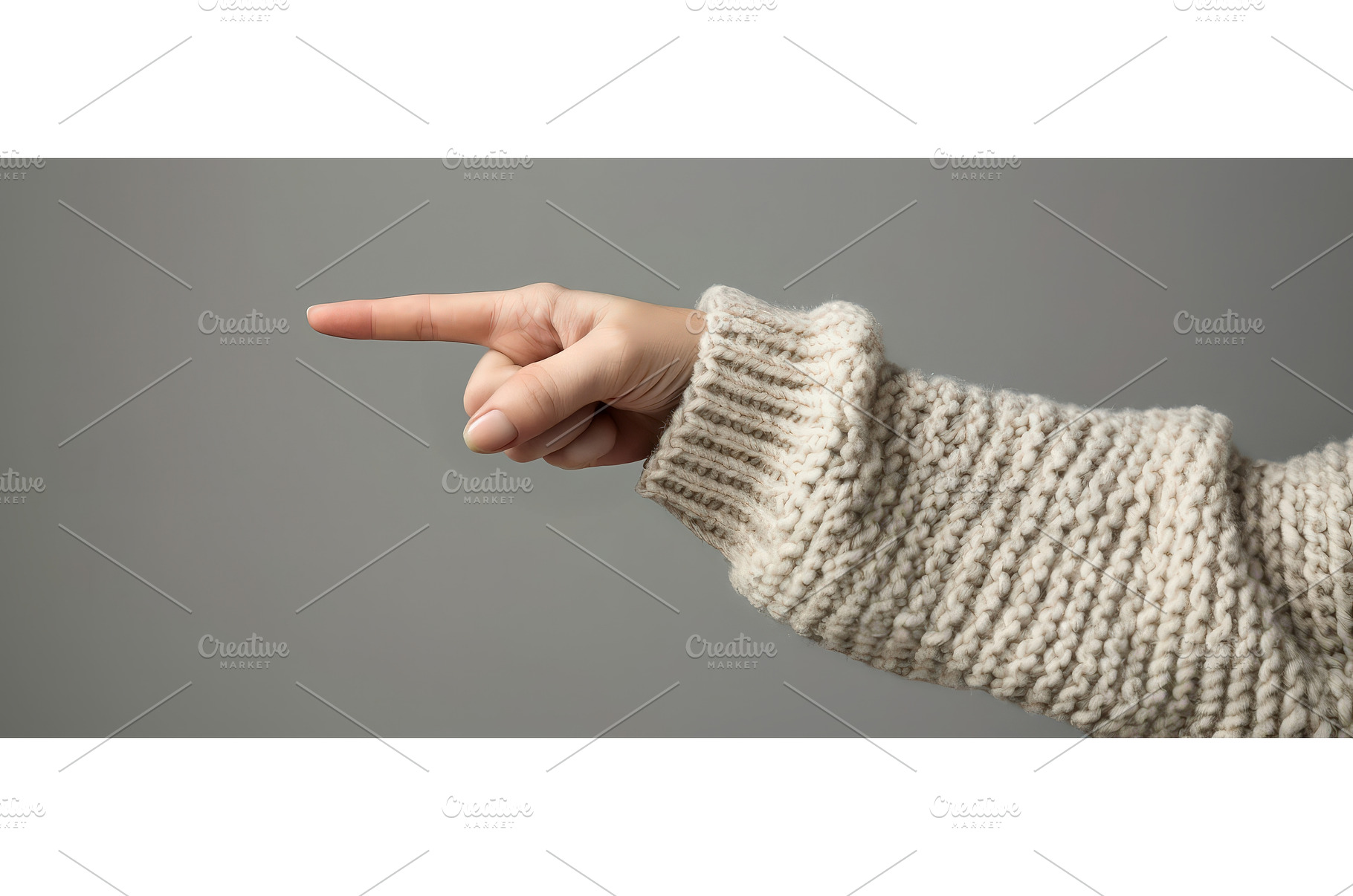 Hand in sweater pointing to the left, a Beauty & Fashion Photo by piter.goskov