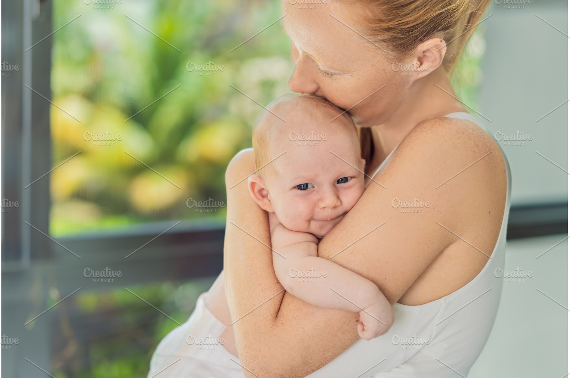 Mother gently hugging her baby at, a Person Photo by Elizaveta Galitskaya