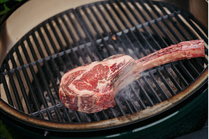 Grilling juicy Tomahawk steak on, a Food & Drink Photo by HalfPoint