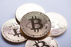 Several bitcoin coins on white background cryptocurrency containing bitcoin