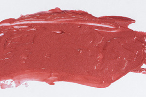 Texture of red glitter cosmetic smear, liquid lipstick on white, an Abstract Photo by ndanko