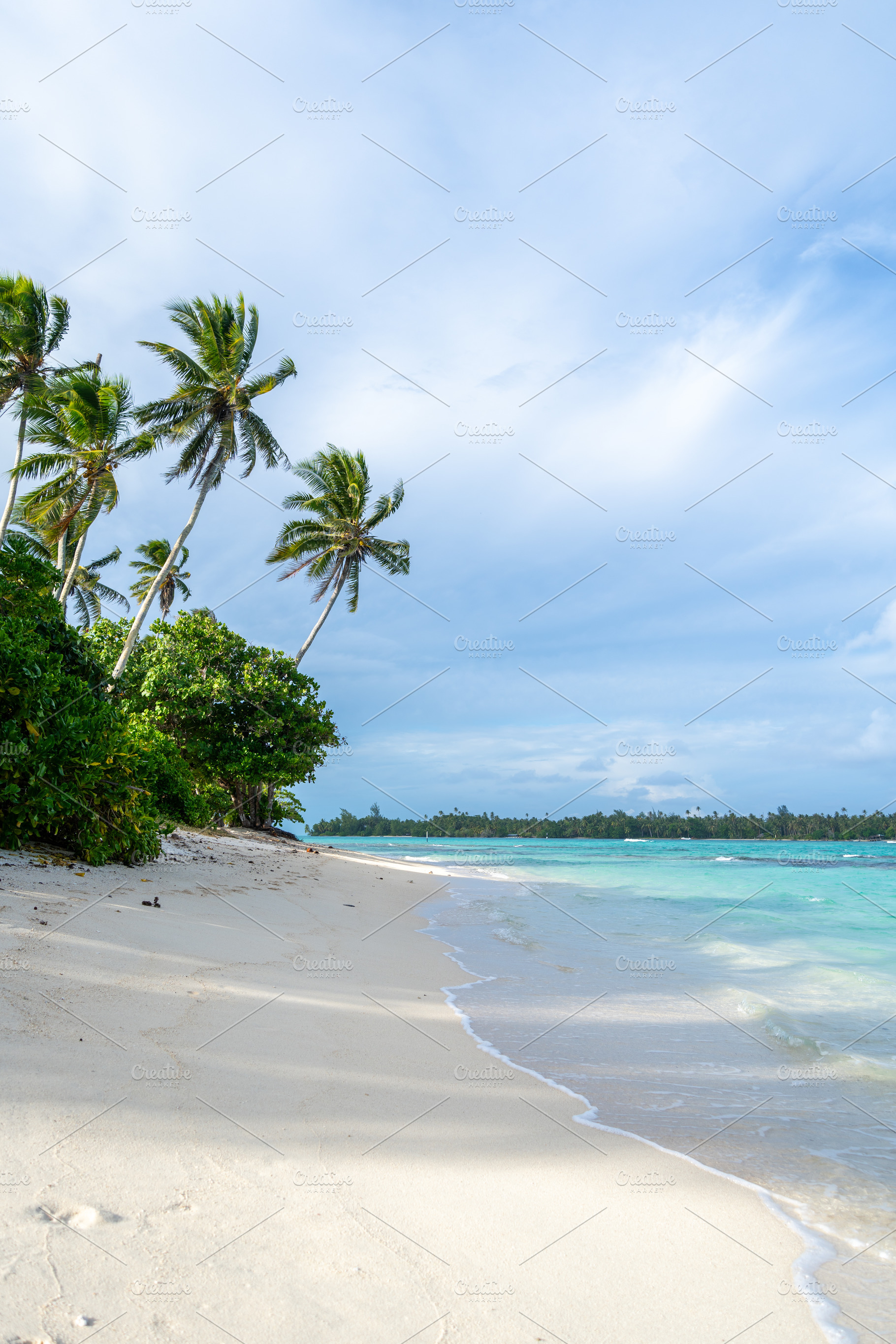 Anini Marae Beach on Huahine, French Polynesia, with turquoise w, a Photo by GoodGoods