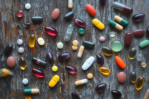 A mix of colorful pills and capsules, a Photo by Pavel_design