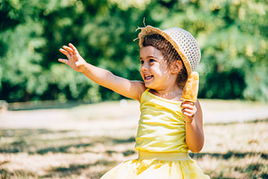 Little girl eating ice cream, a Person Photo by hitdelight
