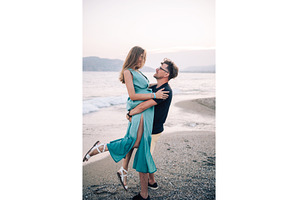 Happy Couple Embracing on a Sandy, a Person Photo by Jan Jack Russo Media