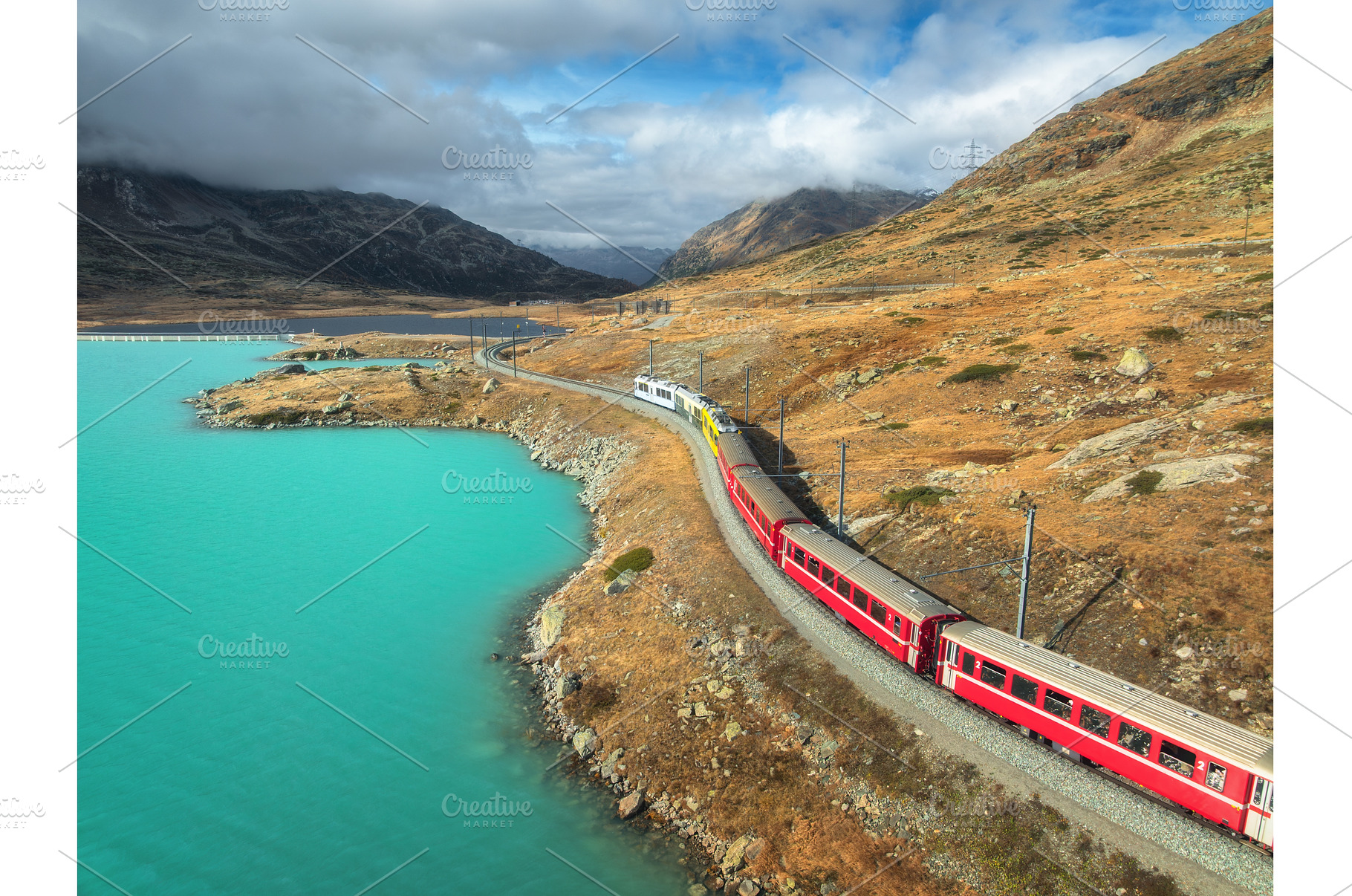 Aerial view of red train near alpine, a Transportation Photo by den-belitsky