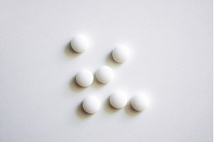Set of seven round white tablets, a Health & Medical Photo by volodymyrshtun13795