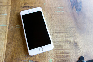 Iphone 6 plus on wood table stock photo containing iphone and iphone6