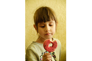 Little girl looking at a pink ice, a Person Photo by Rohan Photography