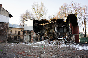 Dilapidated building in Lviv during winter showcasing urban decay and destructi, a Photo by AS photostudio