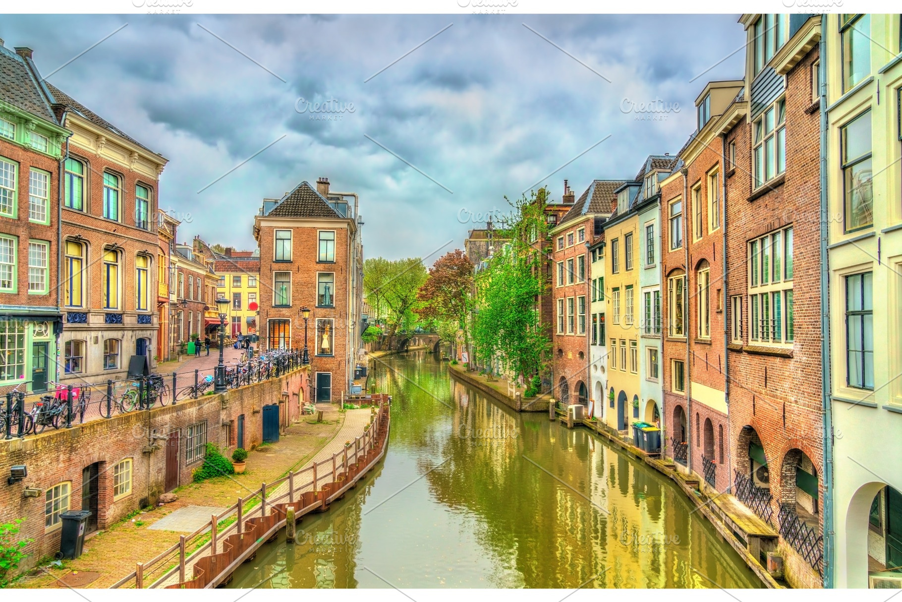 Traditional houses along a canal in utrecht netherlands containing utrecht, an Architecture Photo by Leonid Andronov