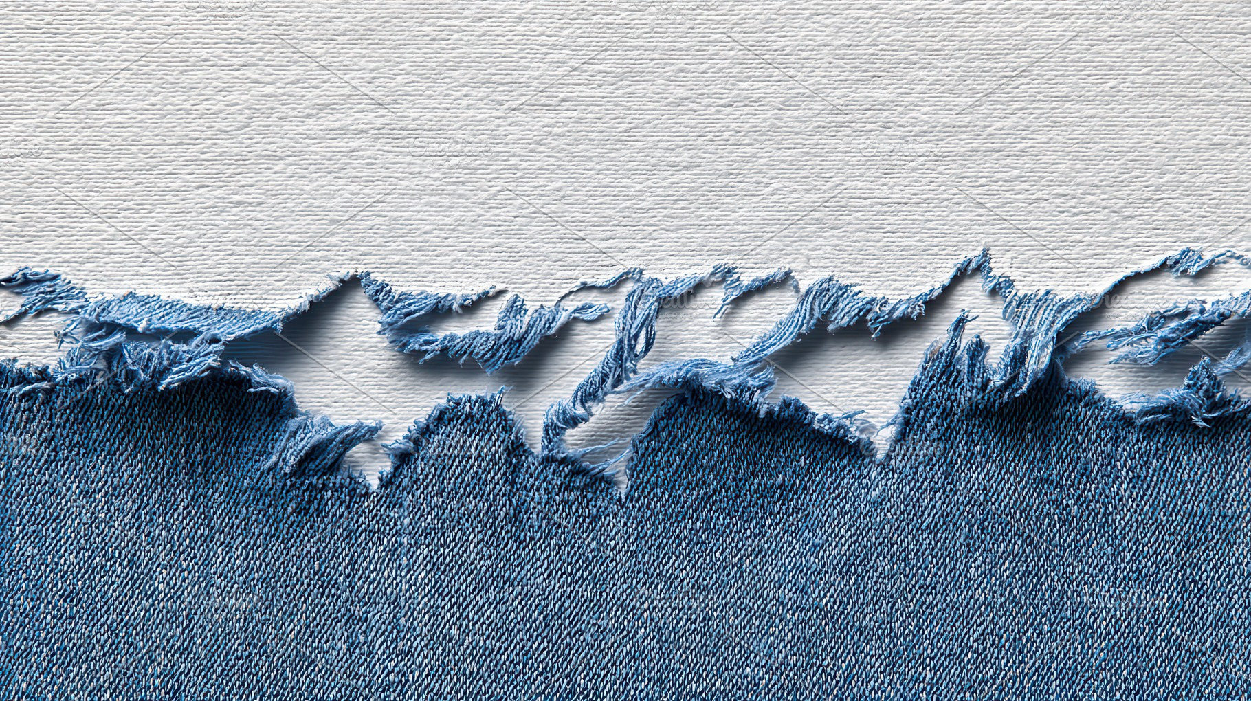 Denim fabric with frayed edges, a Photo by Pavel_design