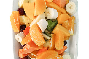Fresh fruit salad on a white plate, a Food & Drink Photo by DanFLCreativo