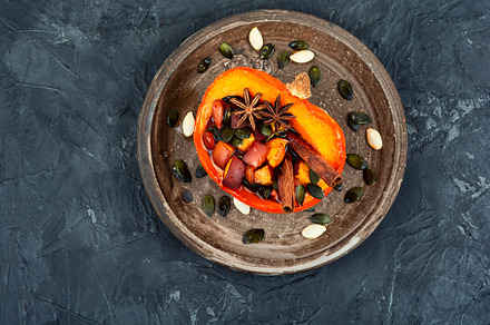 Baked half of pumpkin with fruits, a Food & Drink Photo by MLunov MLunov