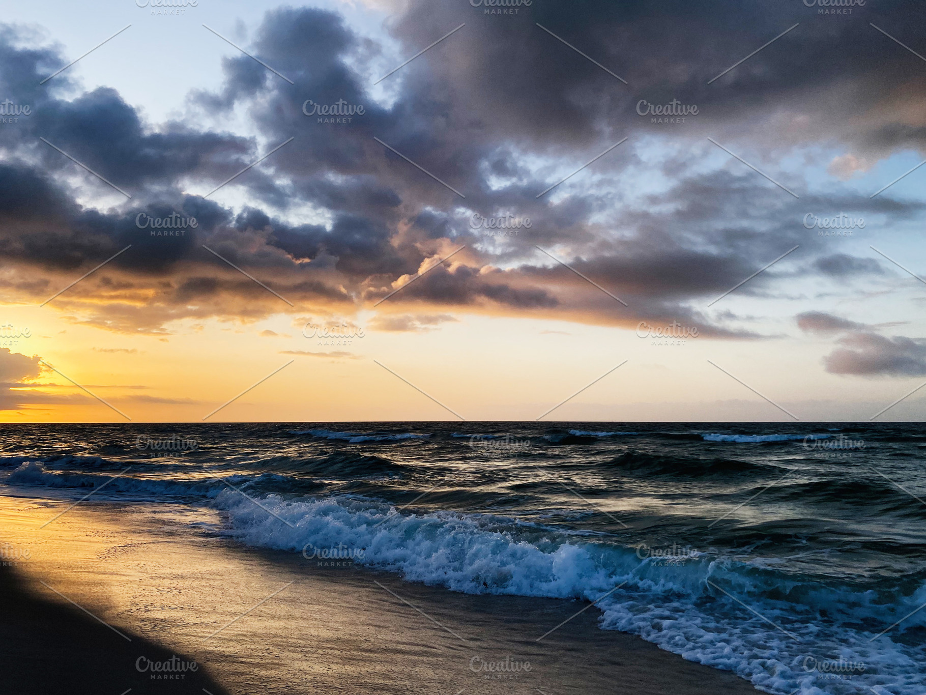 Stunning Florida sunset over the ocean with waves crashing on the sandy Pensaco, a Nature Photo by AS photostudio