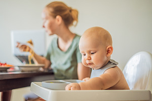 Infant learning independent eating, a Person Photo by Elizaveta Galitskaya