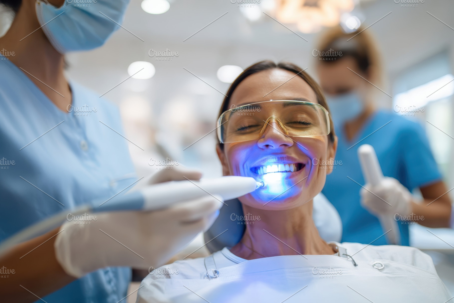 Dentist using laser treatment on patient in clinic, a Health & Medical Photo by AlyaAnd