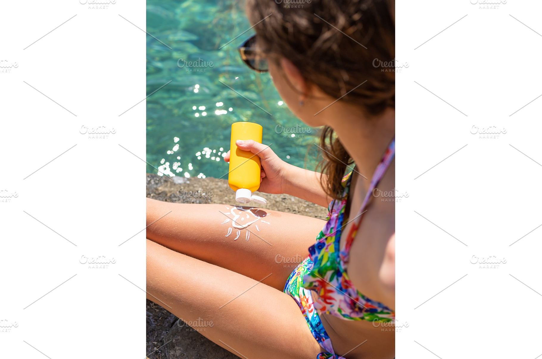 The child has sunscreen on his legs, a Person Photo by yanadjana