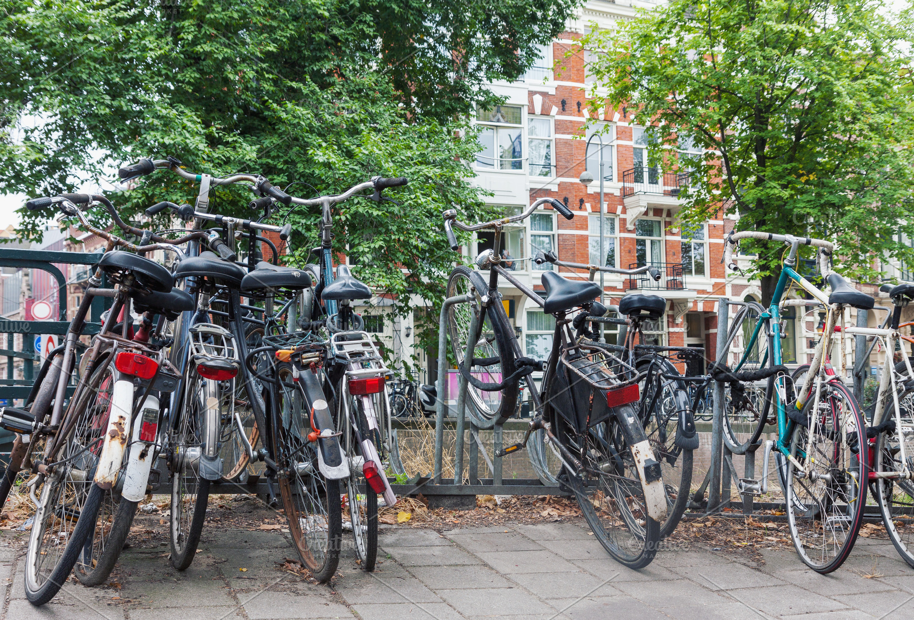Old bicycles parked in Amsterdam, a Transportation Photo by BOOCYS