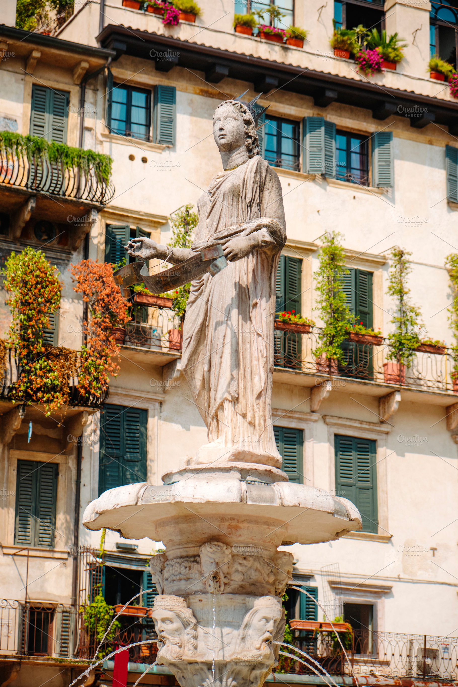 the Madonna Verona fountain in Piazza delle Erbe, a Photo by Nito