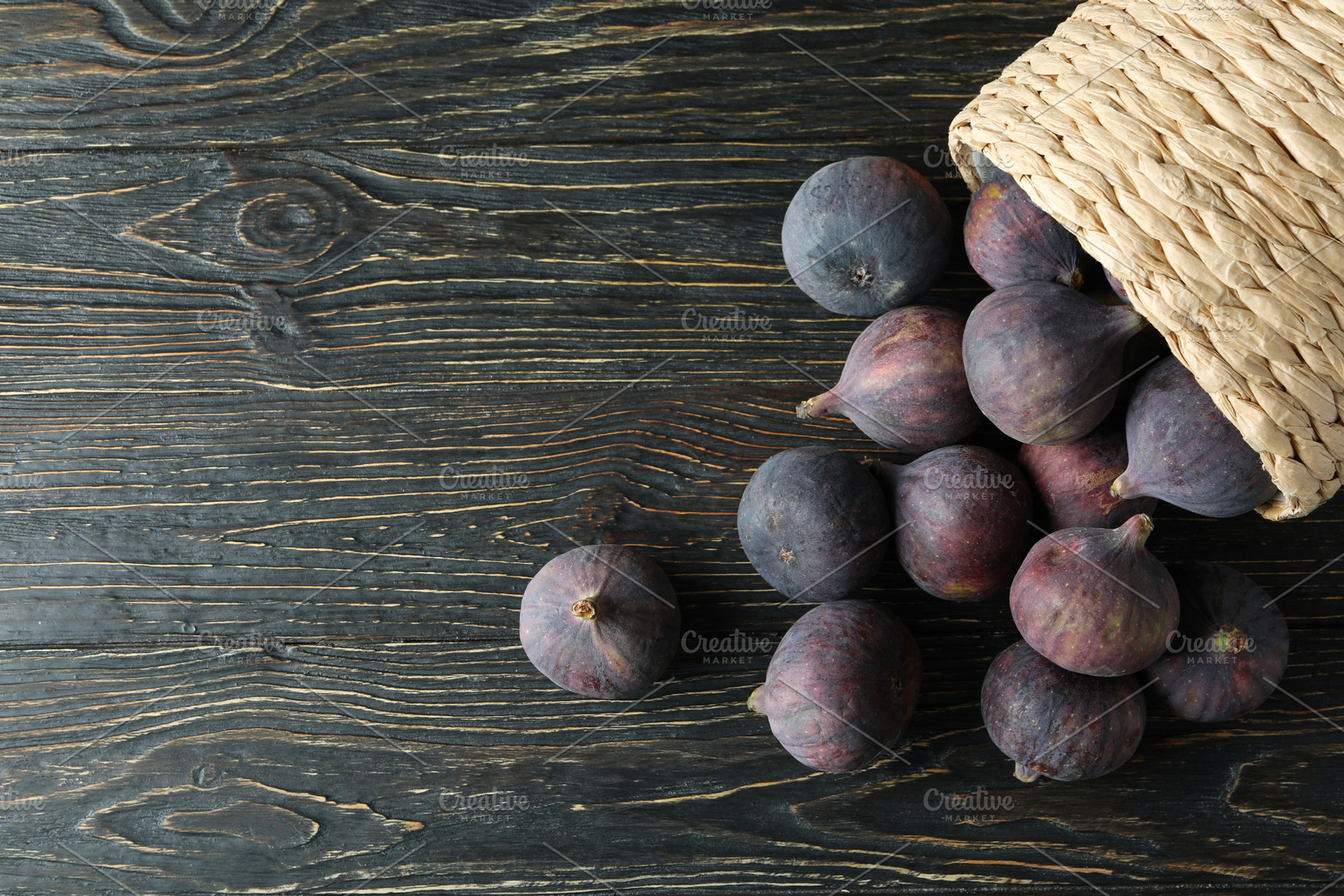Wicker pot with fig on rustic wooden background, a Food & Drink Photo by AtlasStudio PRO
