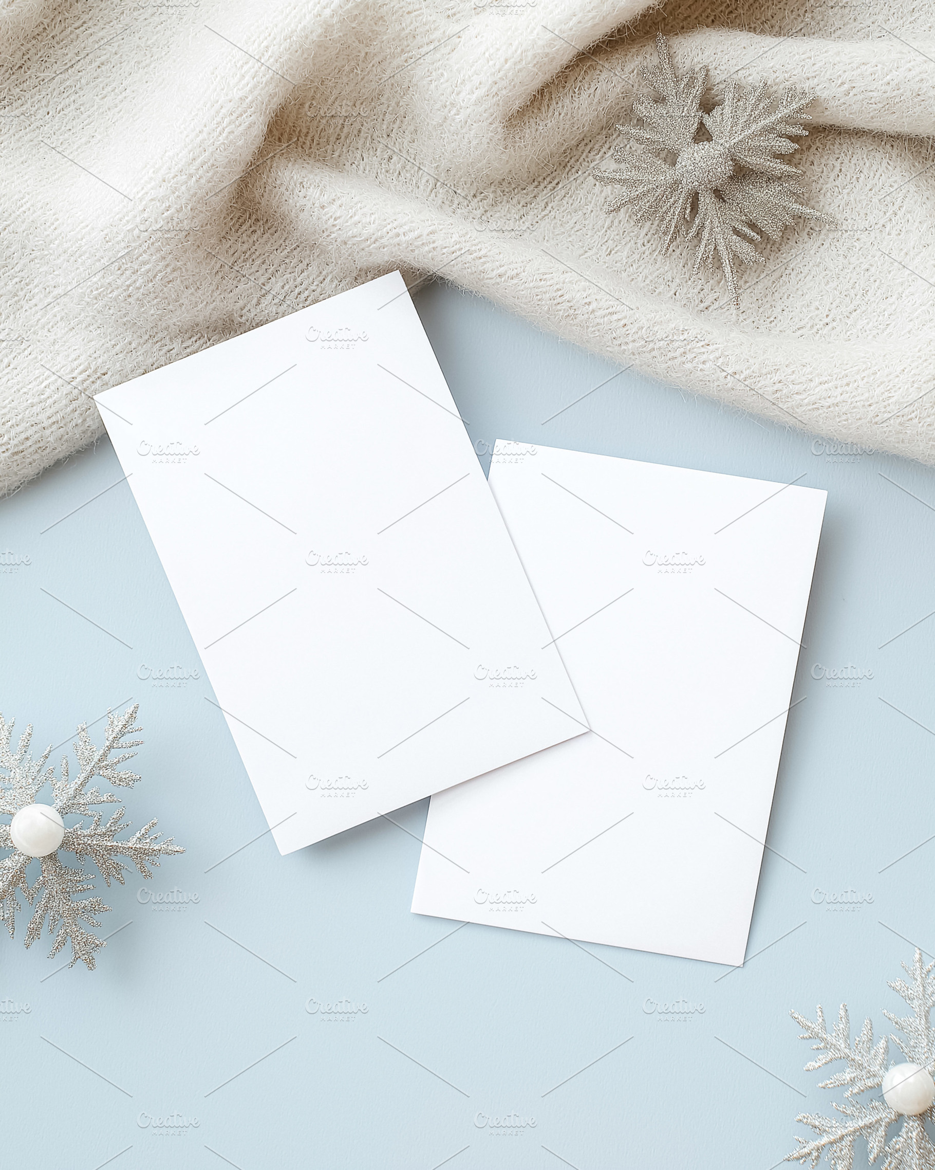 White blank invitation cards mockups with winter snowflakes and warm knitted sw, a Holiday Photo by Studio ANNA
