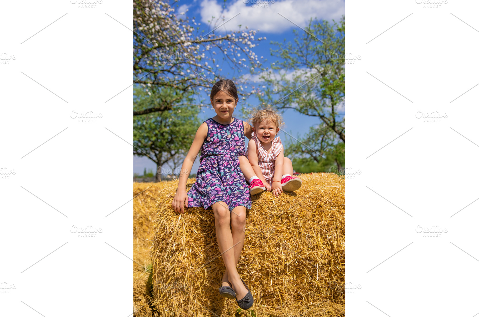 The child is sitting on a pile of, a Nature Photo by yanadjana