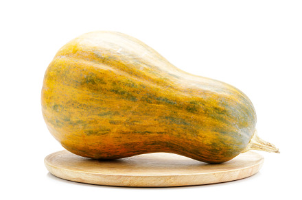 Ripe pumpkin on wooden tray isolated, a Food & Drink Photo by serkum