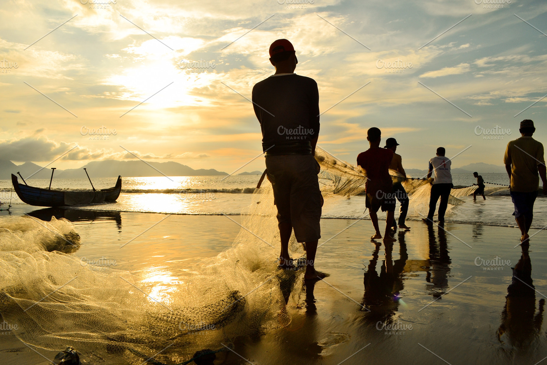Fishermen Pulling Nets As the SunSet, a Person Photo by bastera
