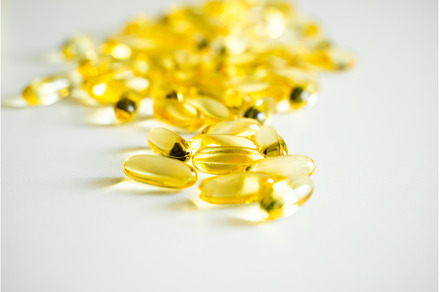 Capsules of Omega 3 on white, a Health & Medical Photo by volodymyrshtun13795